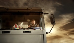 Portrait of truck driver at the sunset