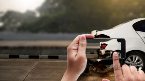 Hit-and-run accident victim takes photo of car fleeing from crash scene.