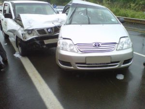 Car accident with one car getting hit by car from the side. 