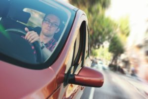 Man driving red car asks "What is the average time for a car accident settlement?"