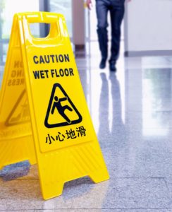 Wet floor sign on shiny floor and no liability insurance.