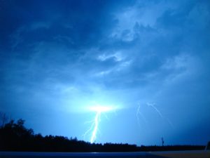 Vivid lightning strike raises question of whether an act of God negates car accident liability.