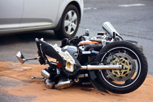 Motorcycle accident with automobile.