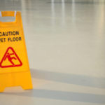 close up shot of a yellow caution on floor