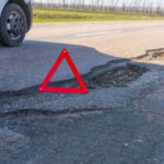 Large Deep Pothole An Example Of Poor Road Maintenance Due To Re