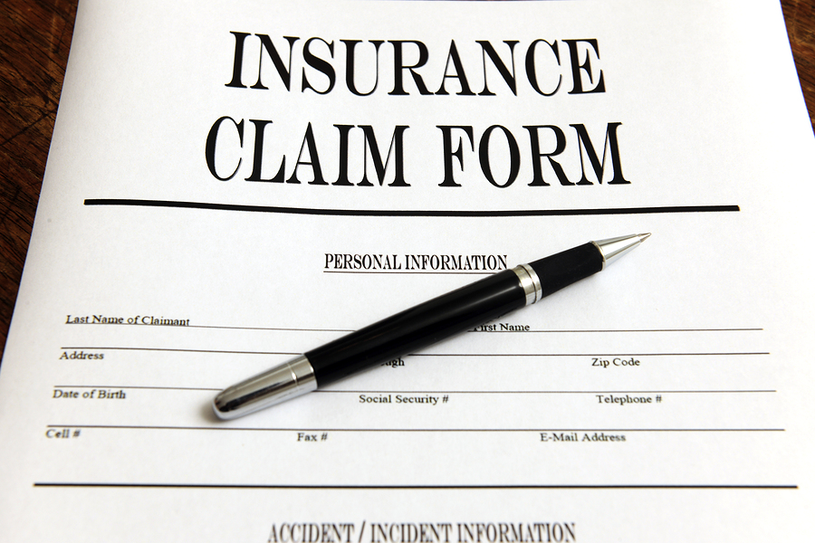 Blank Insurance Claim Form And Pen