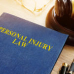 Personal Injury Law On A Desk And Gavel.
