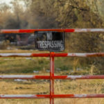 Clear Square No Trespassing Sign On The Gate Of A Private Proper