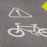 Bicycle Lane Sign On Asphalt Road. Concept Of Biking Safety And