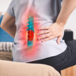 Pain In The Spine, A Man With Backache At Home, Injury In The Lo