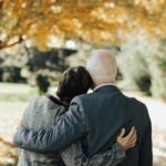 grieving older couple