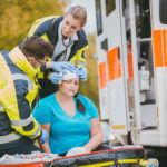 EMTs bandage head injury