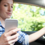 woman texting and driving