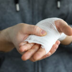 gauze on wounded hand