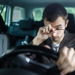 drowsy man behind wheel