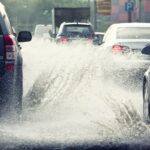 cars in traffic on flooded road